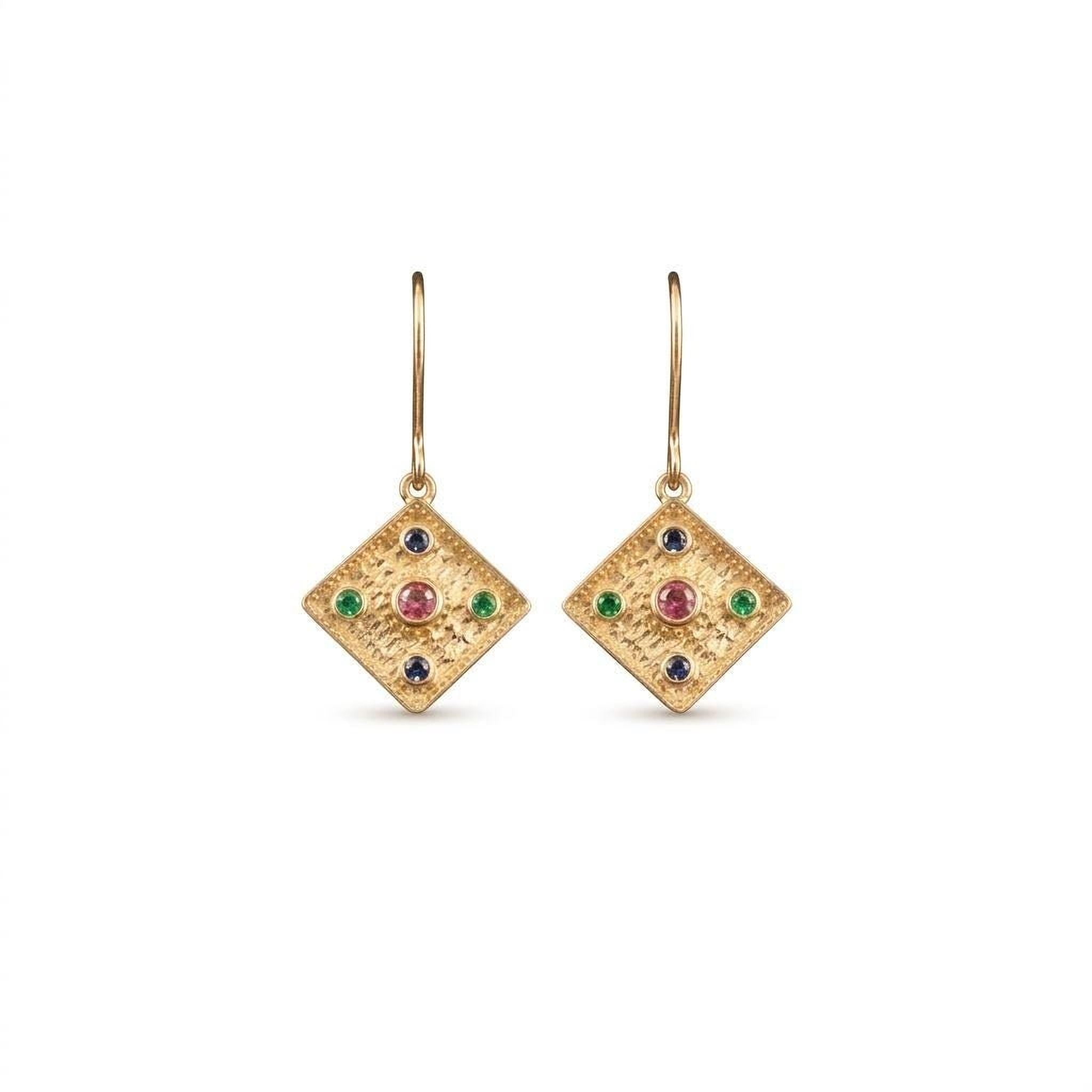 A pair of gold earrings with diamond-shaped designs and colorful gemstones.