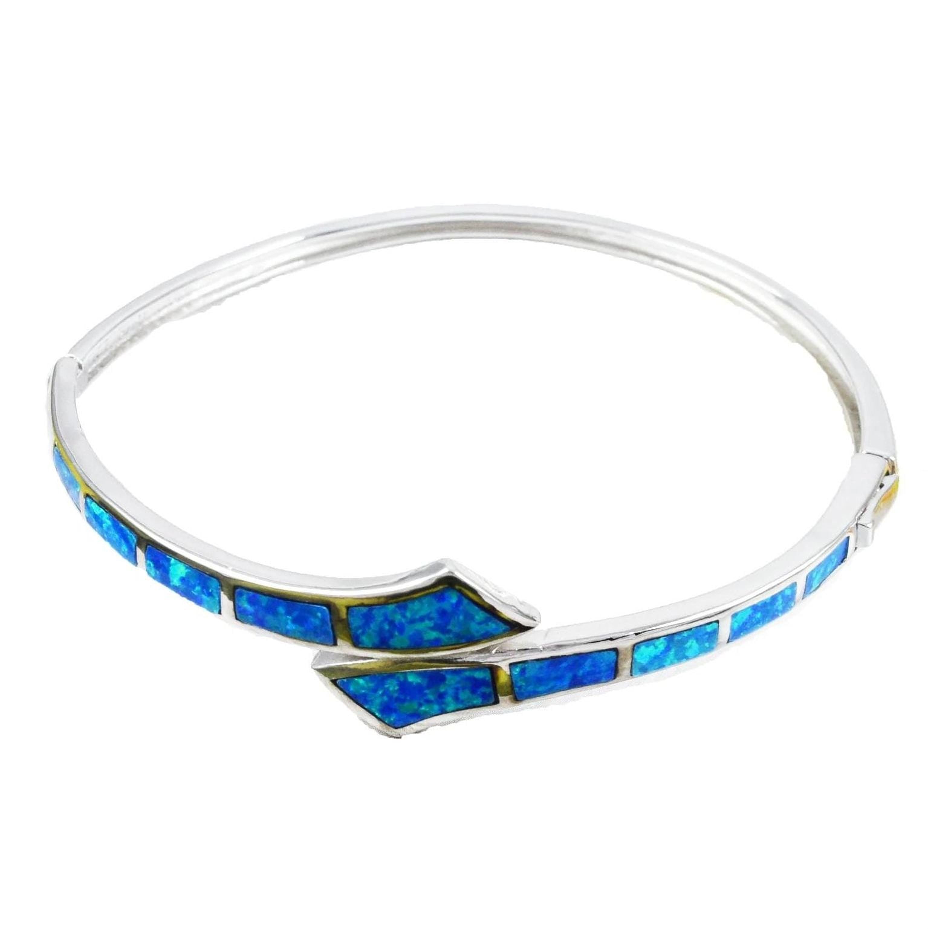 A silver bracelet with blue opal stones set in a curved design.