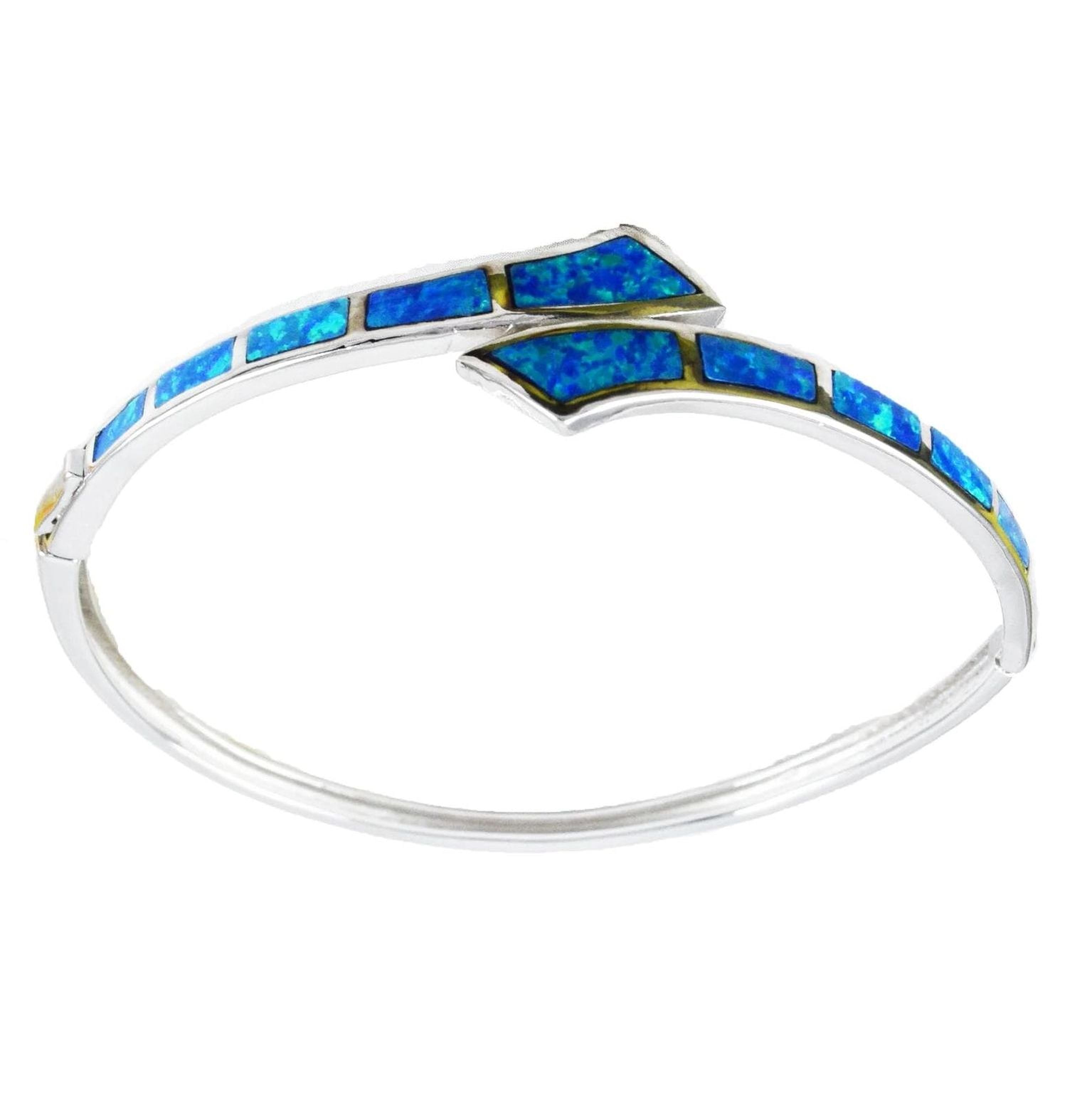 A silver bracelet with blue opal stones arranged in a curved pattern.