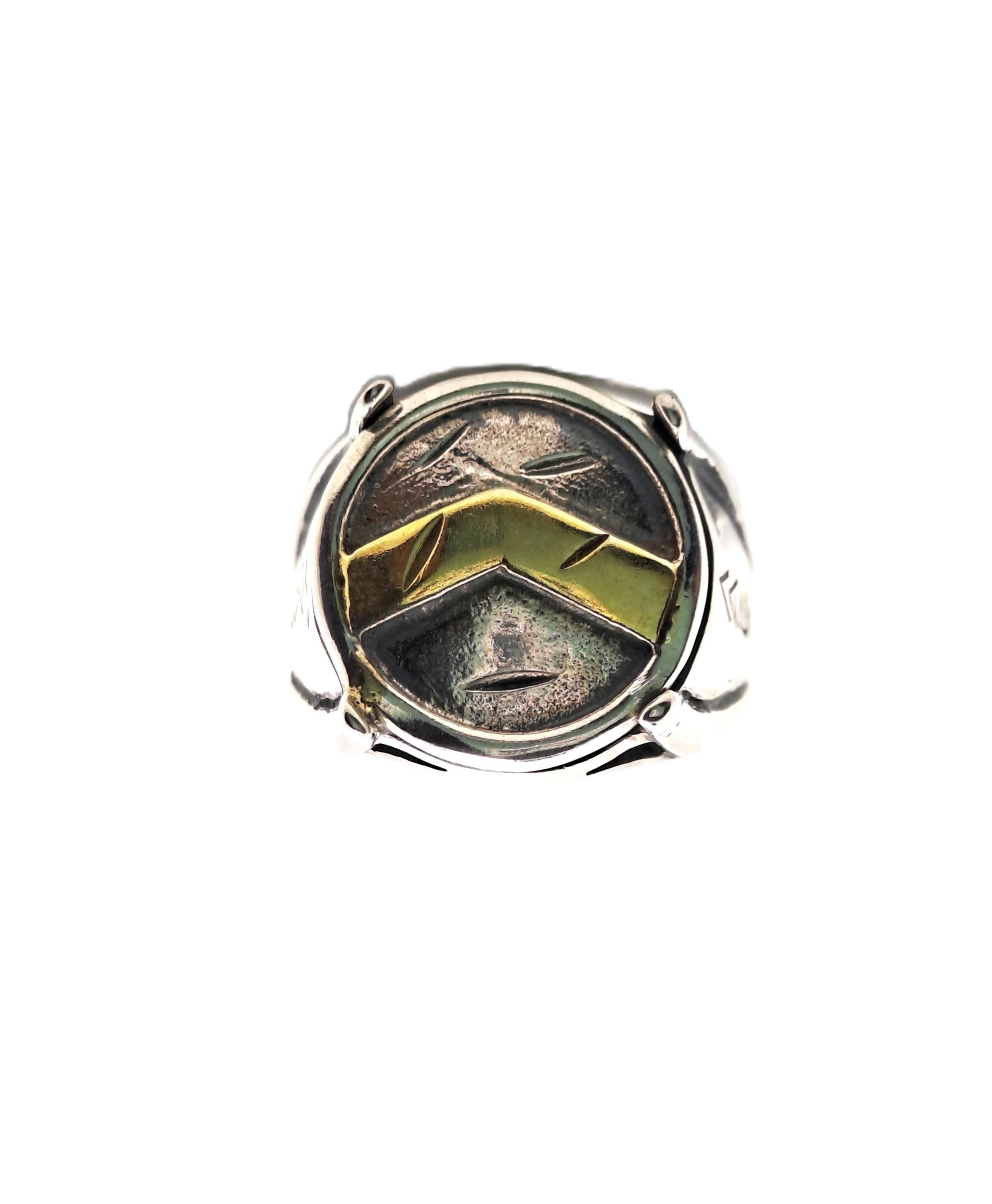 a silver ring with a unique design.