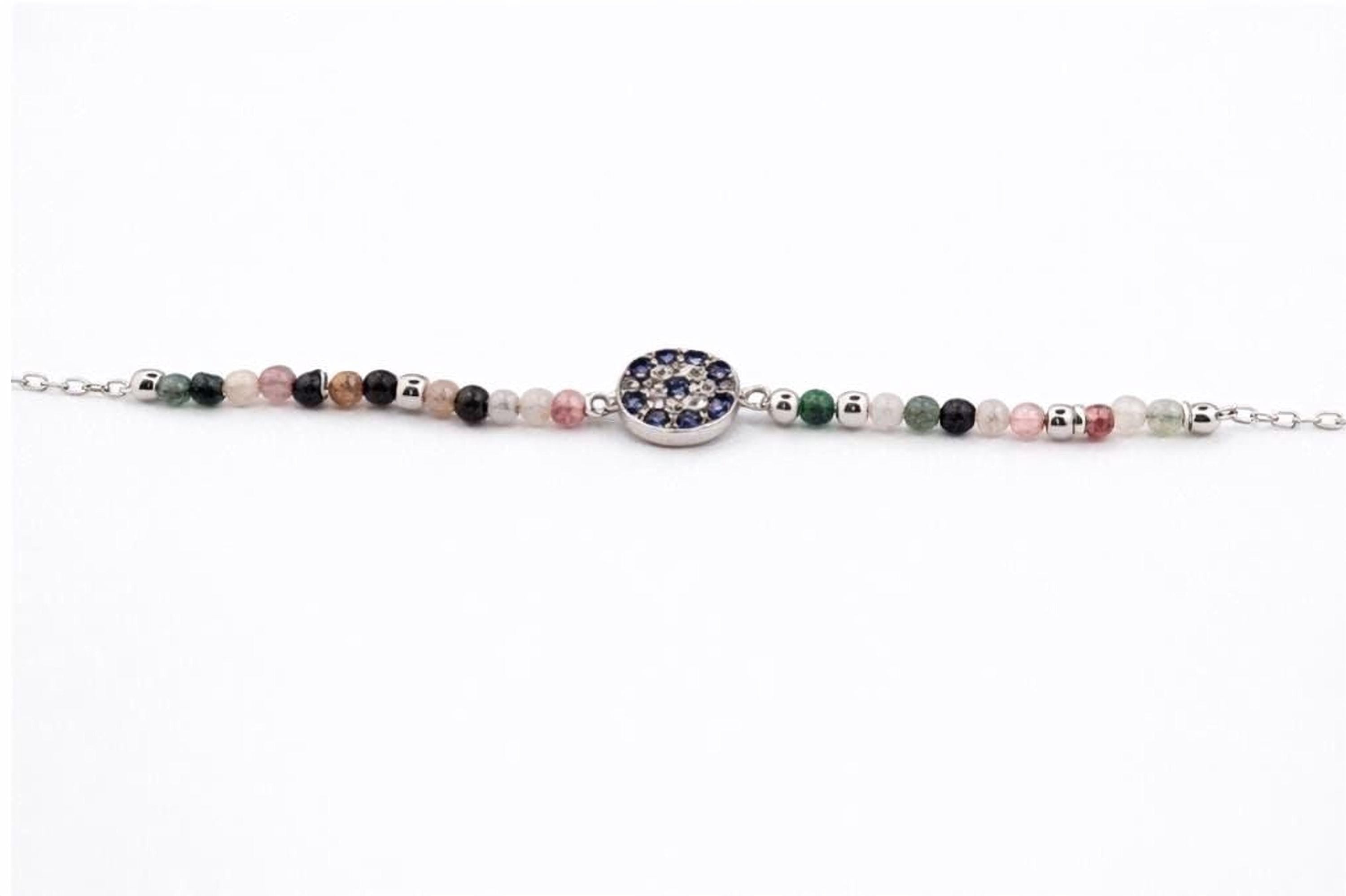 A bracelet made of colorful beads and a central blue gemstone.