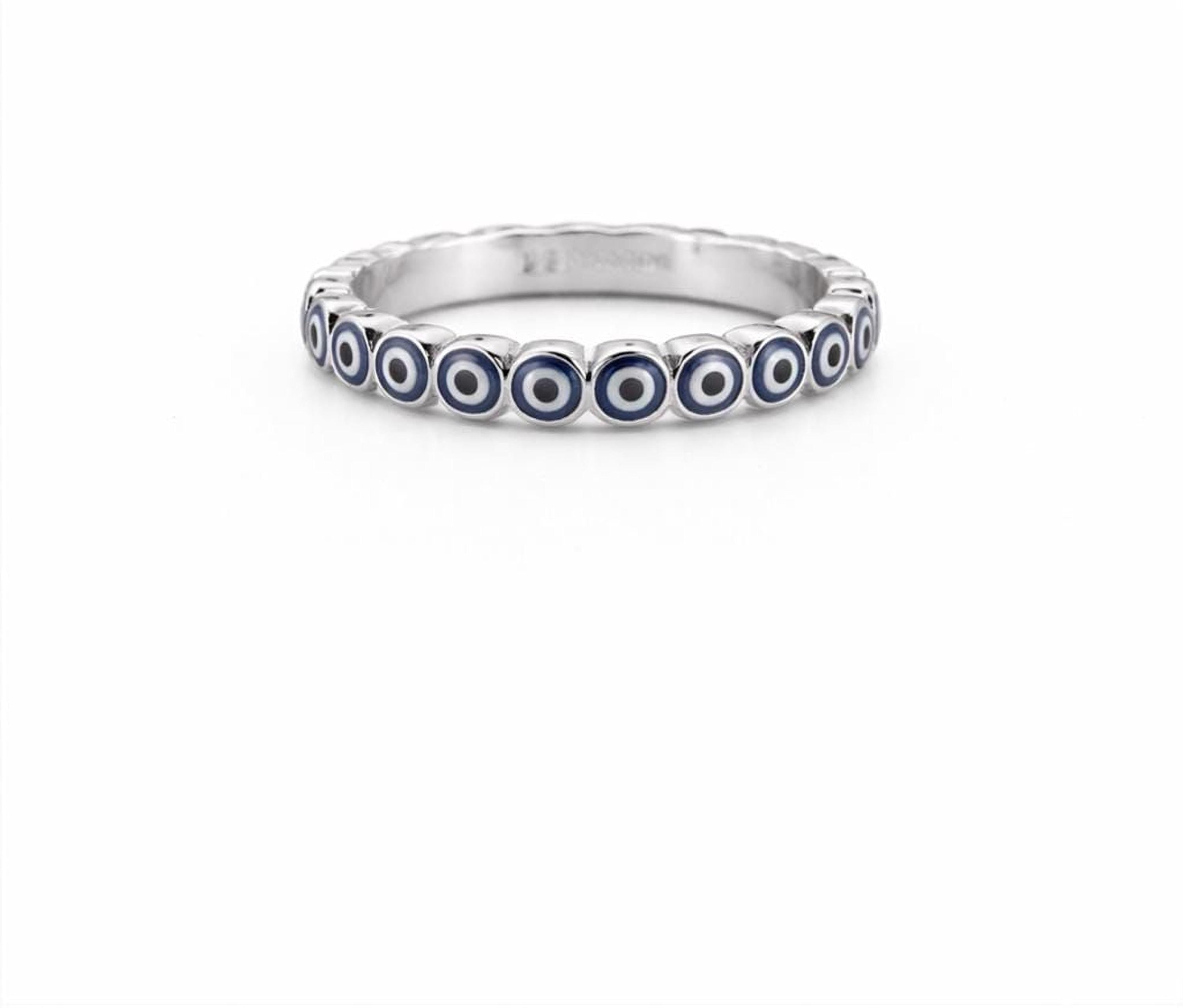 A silver ring with blue circles arranged in a circular pattern.