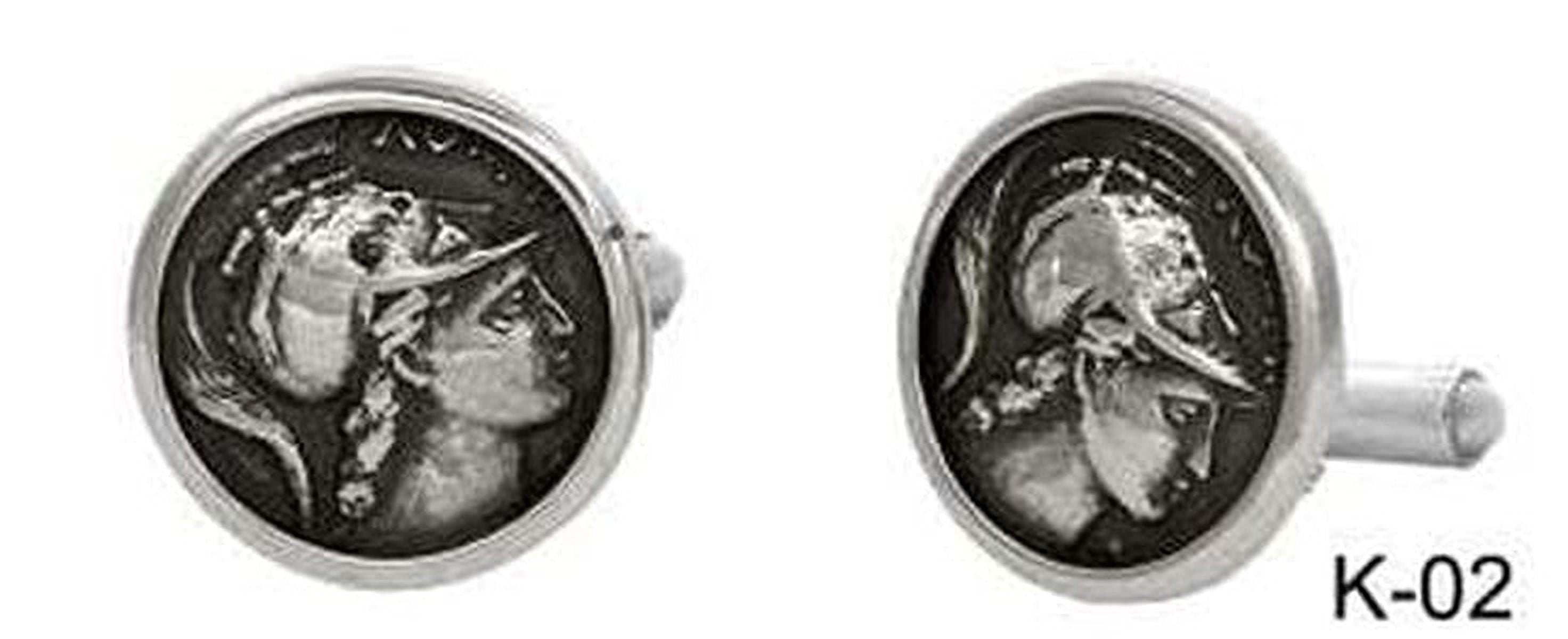 two silver cufflinks with a circular design depicting a profile of a person's face.
